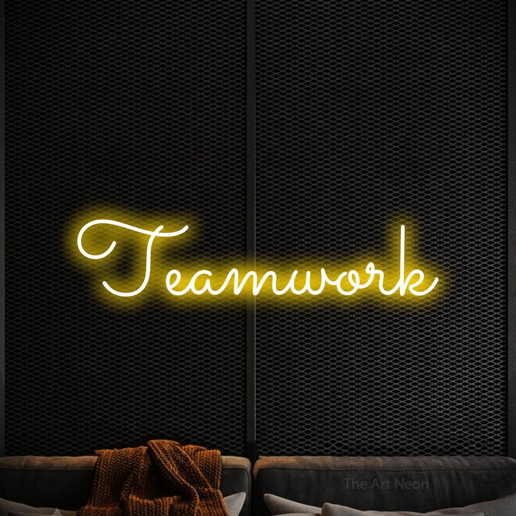 LED neon sign reading “Teamwork”, arranged in a single line.