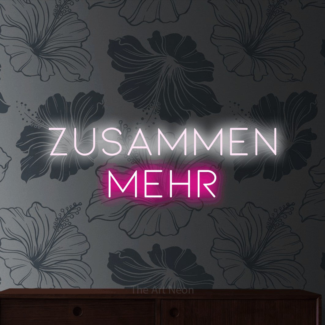 LED neon sign reading “ZUSAMMEN MEHR”, arranged in 2 lines.