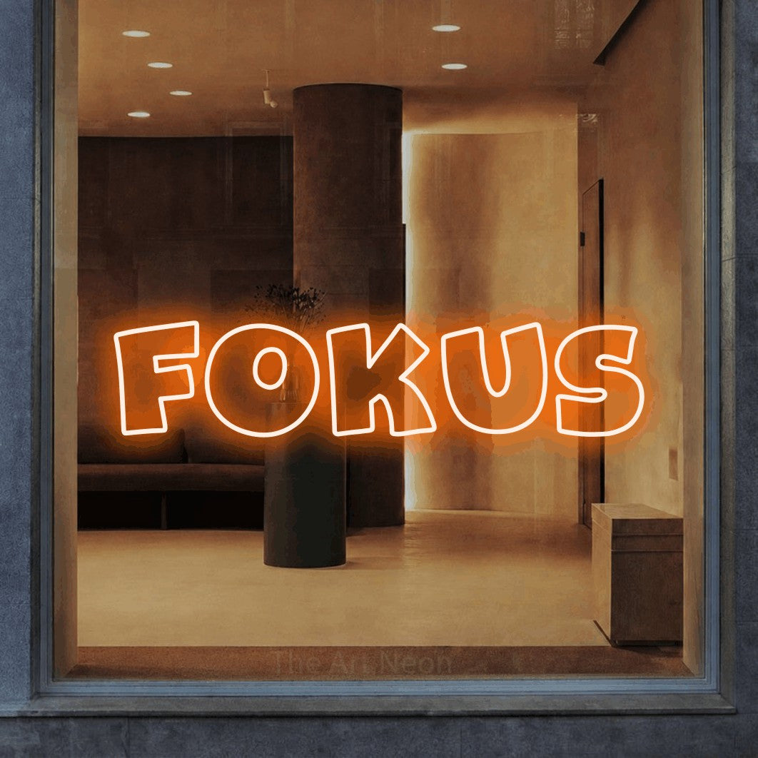 LED neon sign reading “Fokus”, arranged in a single line.