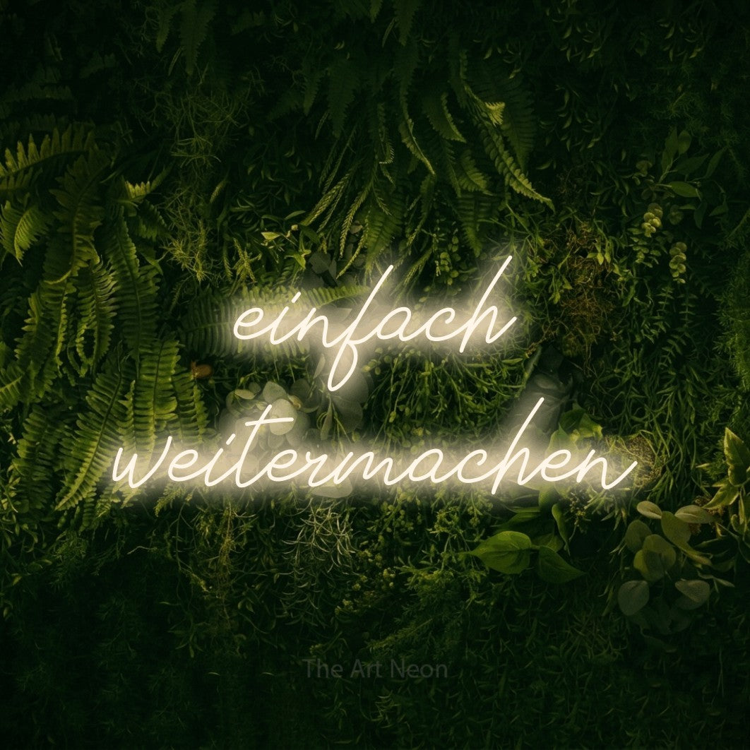 LED neon sign reading “einfach weitermachen”, arranged in 2 lines.