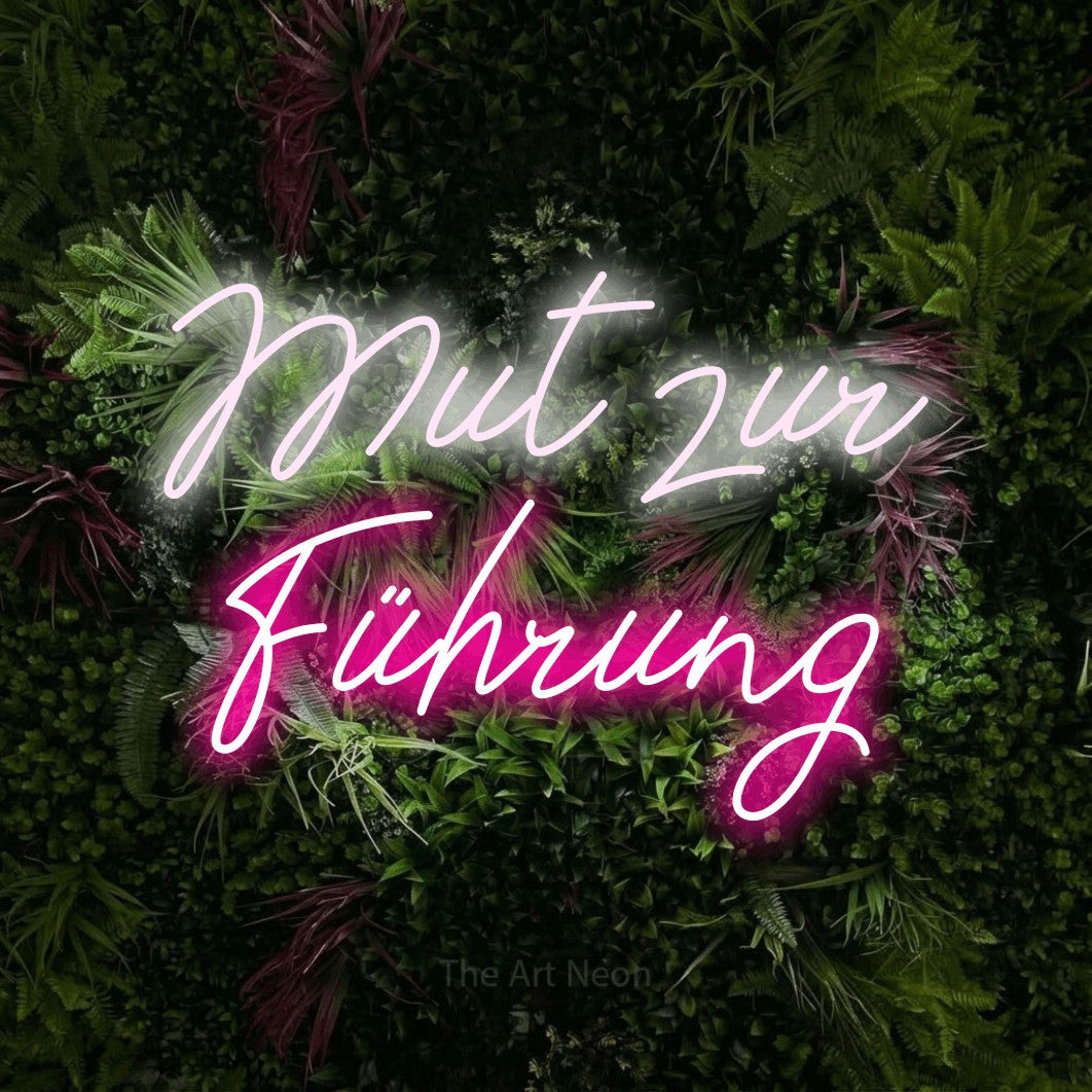 LED neon sign reading “Mut zur Führung”, arranged in 2 lines.