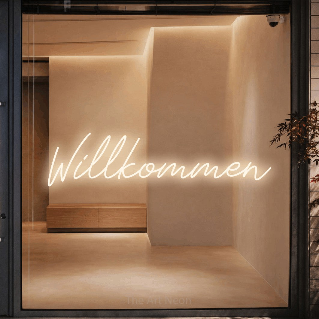 LED neon sign reading “Willkommen”, arranged in a single line.