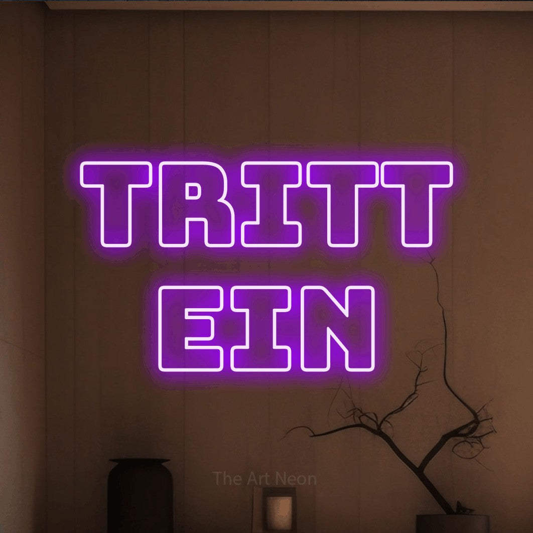 LED neon sign reading “Tritt ein”, arranged in 2 lines.