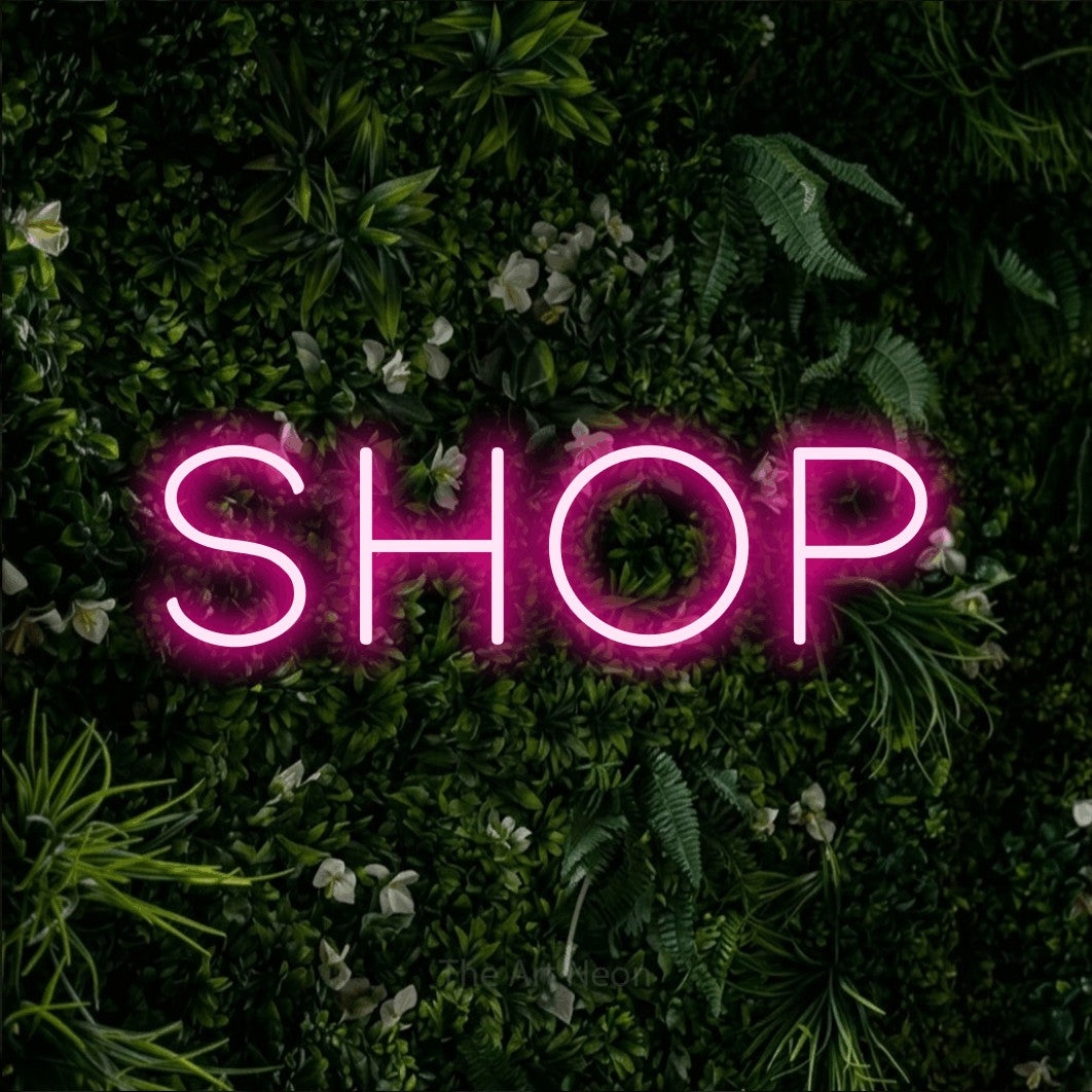 LED neon sign reading “SHOP”, arranged in a single line.