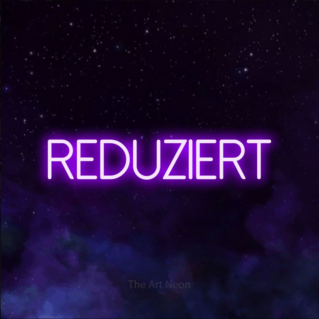 LED neon sign reading “REDUZIERT”, arranged in a single line.