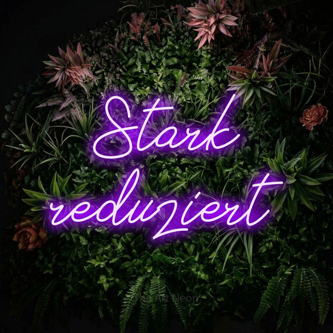 LED neon sign reading “Stark reduziert”, arranged in 2 lines.