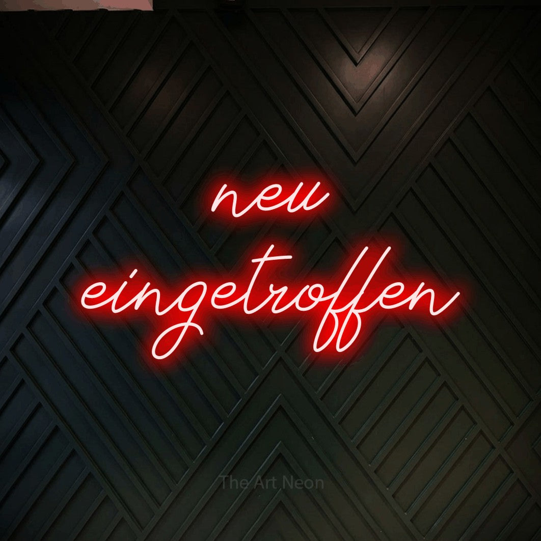LED neon sign reading “neu eingetroffen”, arranged in 2 lines.