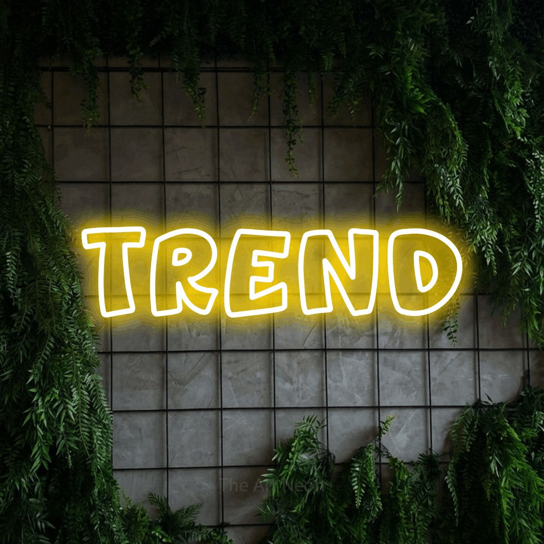 LED neon sign reading “TREND”, arranged in a single line.