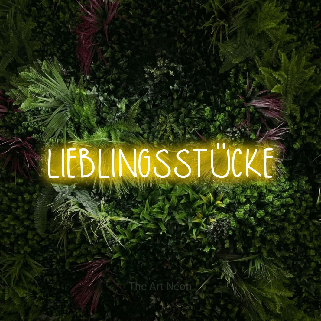 LED neon sign reading “LIEBLINGSSTÜCKE”, arranged in a single line.