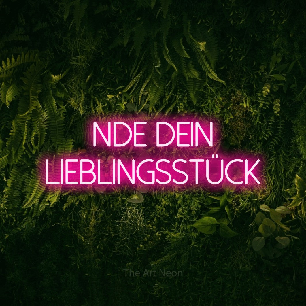 LED neon sign reading “finde dein lieblingsstück”, arranged in 2 lines.