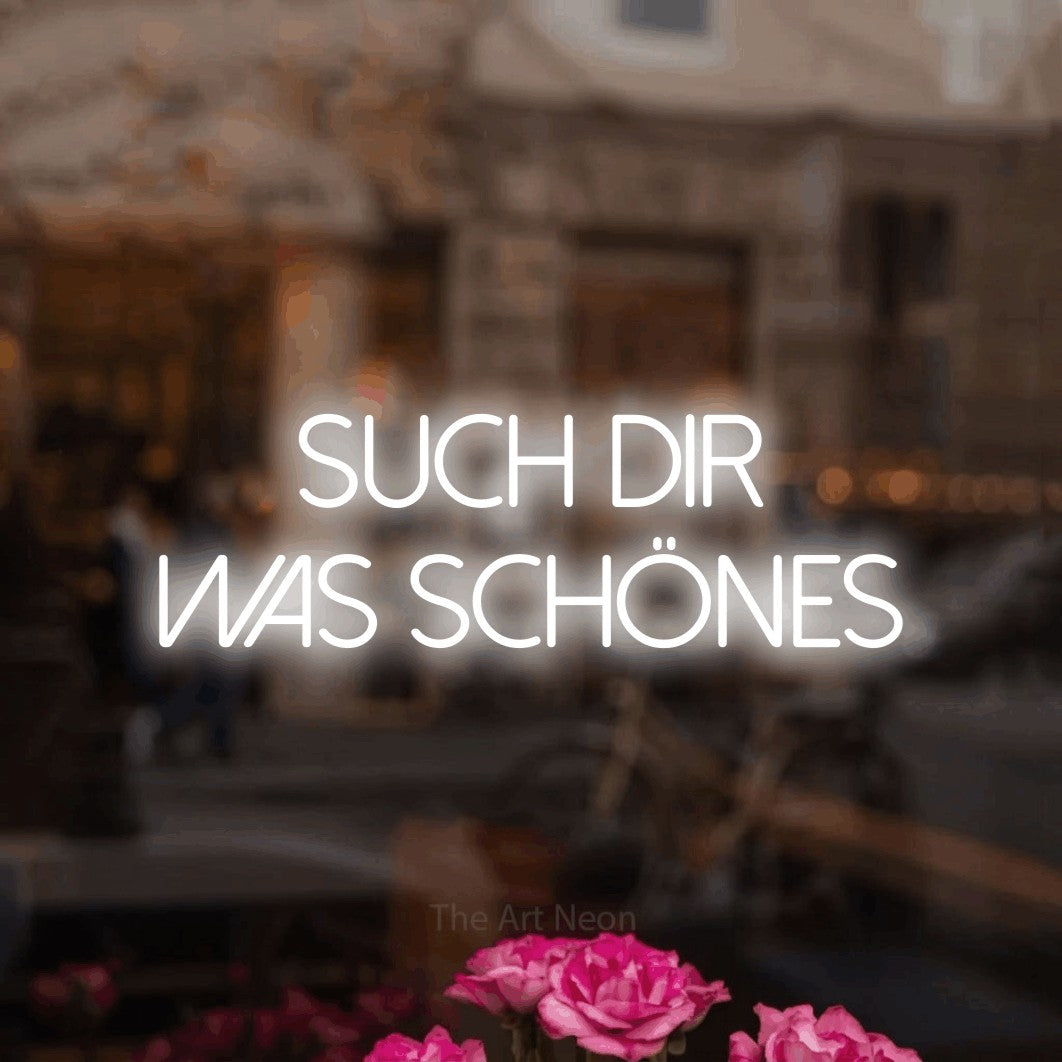 LED neon sign reading “Such dir was Schönes”, arranged in 2 lines.