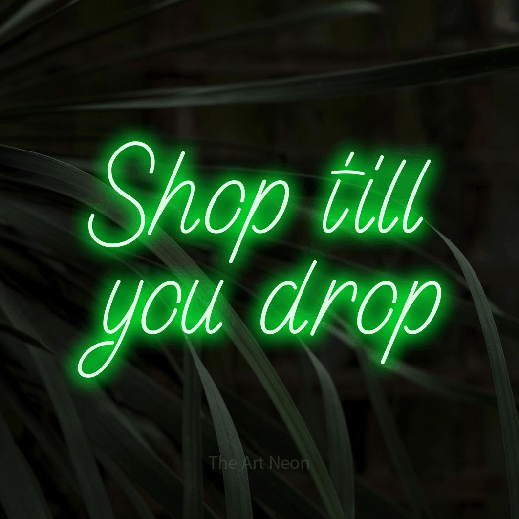 LED neon sign reading “Shop till you drop”, arranged in 2 lines.