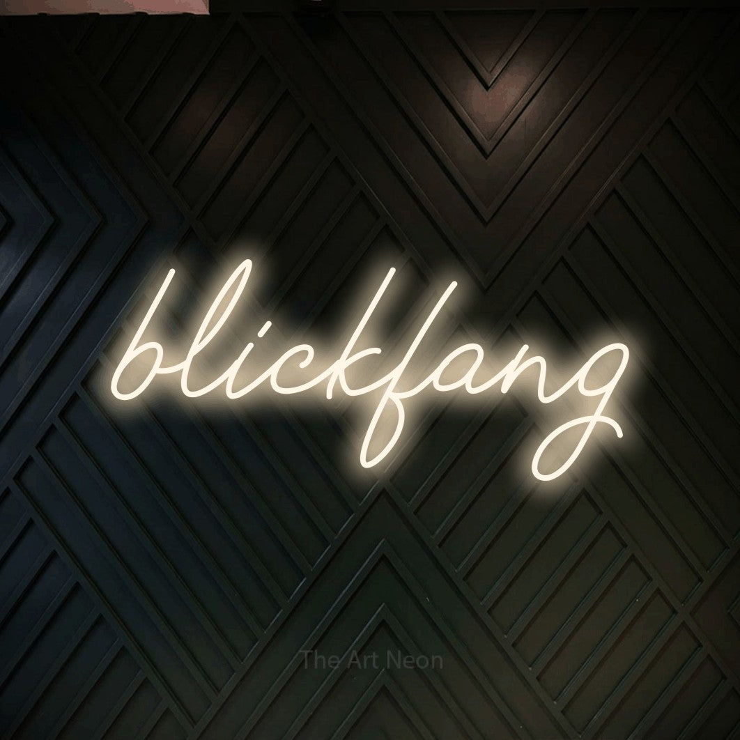 LED neon sign reading “blickfang”, arranged in a single line.