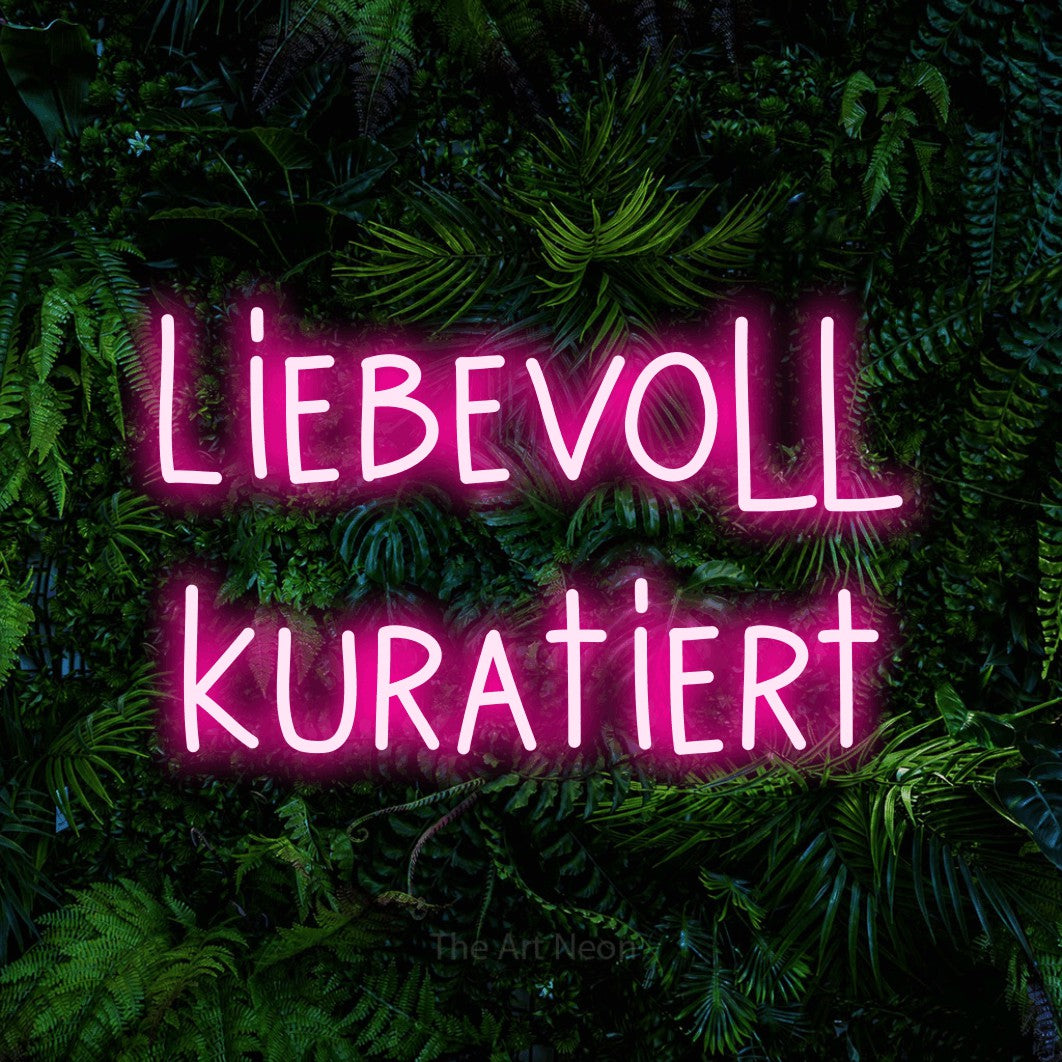 LED neon sign reading “Liebevoll kuratiert”, arranged in 2 lines.