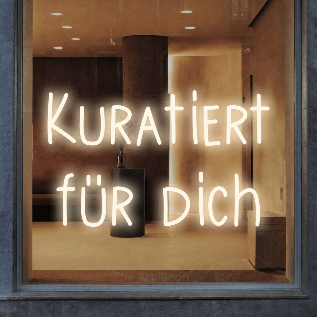 LED neon sign reading “Kuratiert für dich”, arranged in 2 lines.