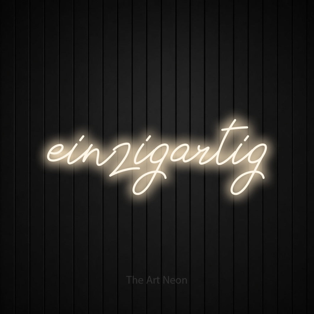 LED neon sign reading “einzigartig”, arranged in a single line.