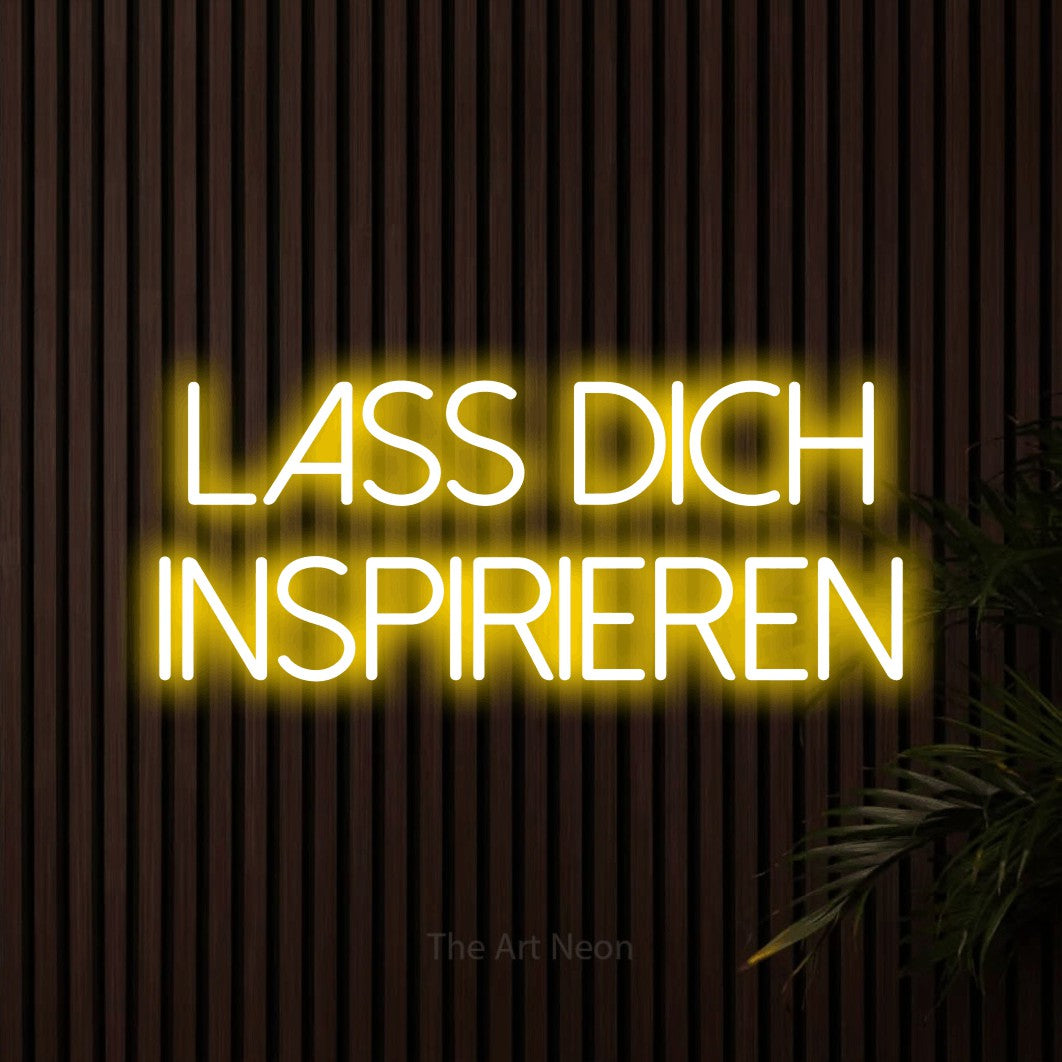 LED neon sign reading “Lass dich inspirieren”, arranged in 2 lines.