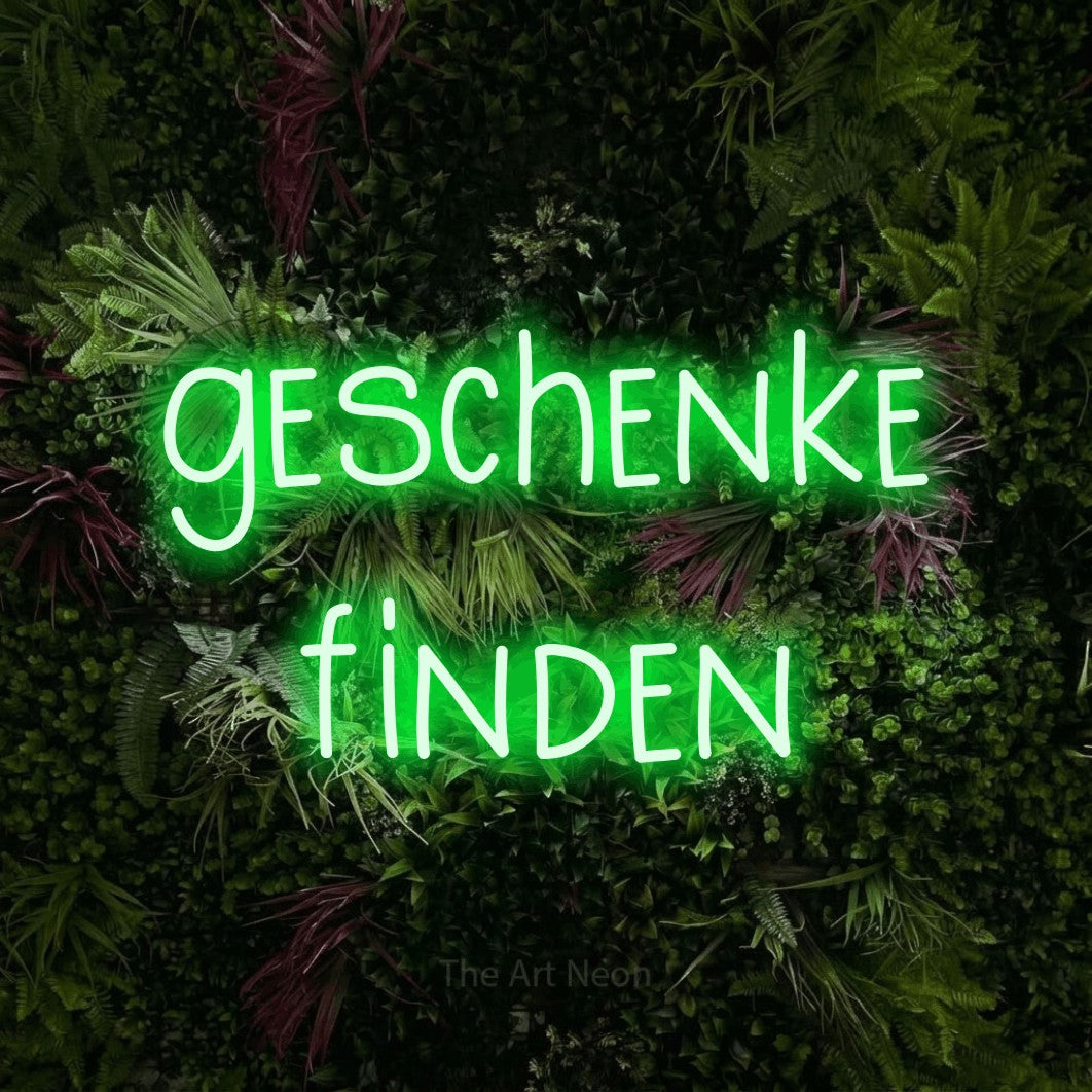 LED neon sign reading “geschenke finden”, arranged in 2 lines.