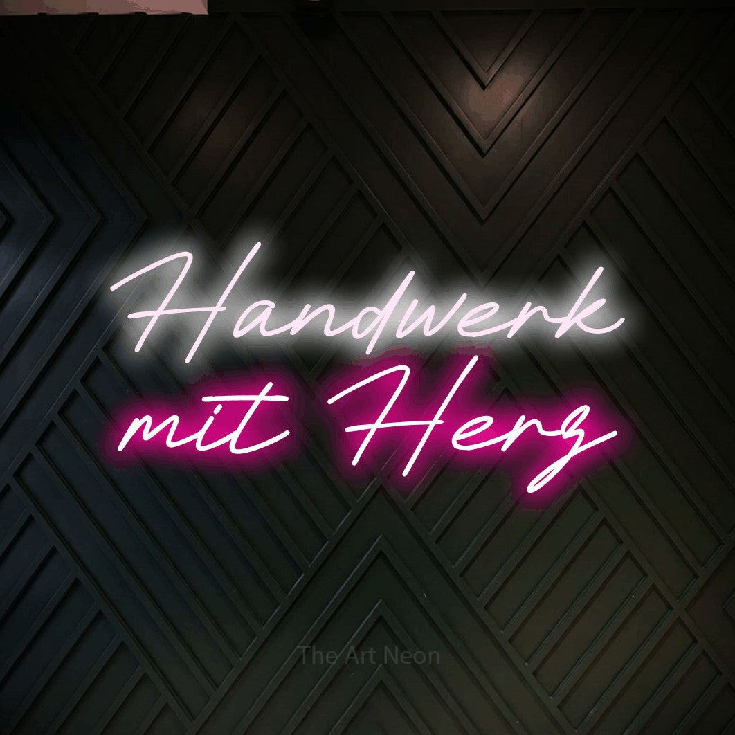 LED neon sign reading “Handwerk mit Herz”, arranged in 2 lines.