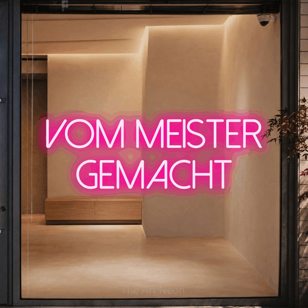 LED neon sign reading “Vom Meister gemacht”, arranged in 2 lines.
