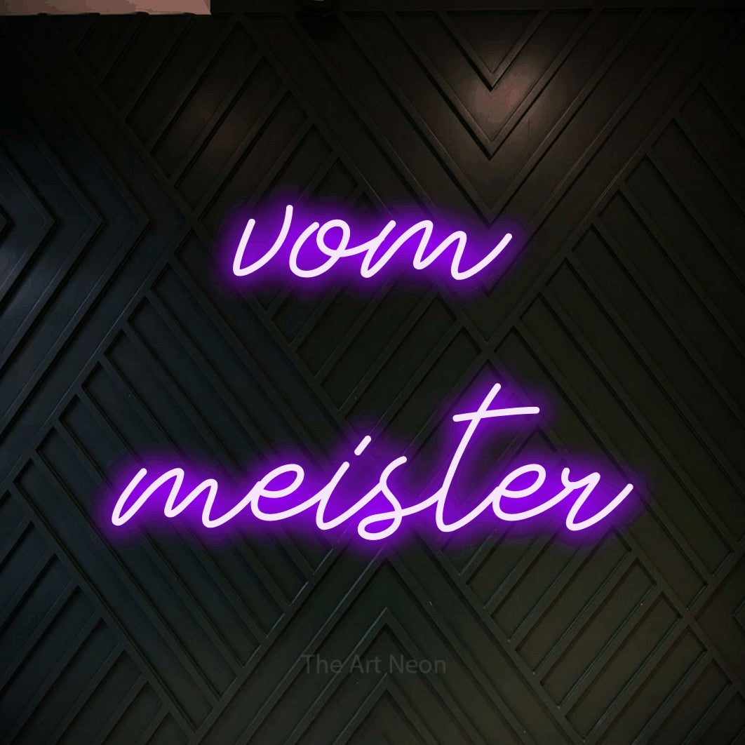 LED neon sign reading “vom meister”, arranged in 2 lines.