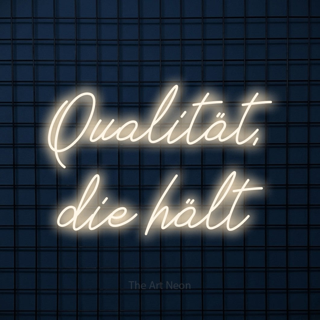 LED neon sign reading “Qualität, die hält”, arranged in 2 lines.