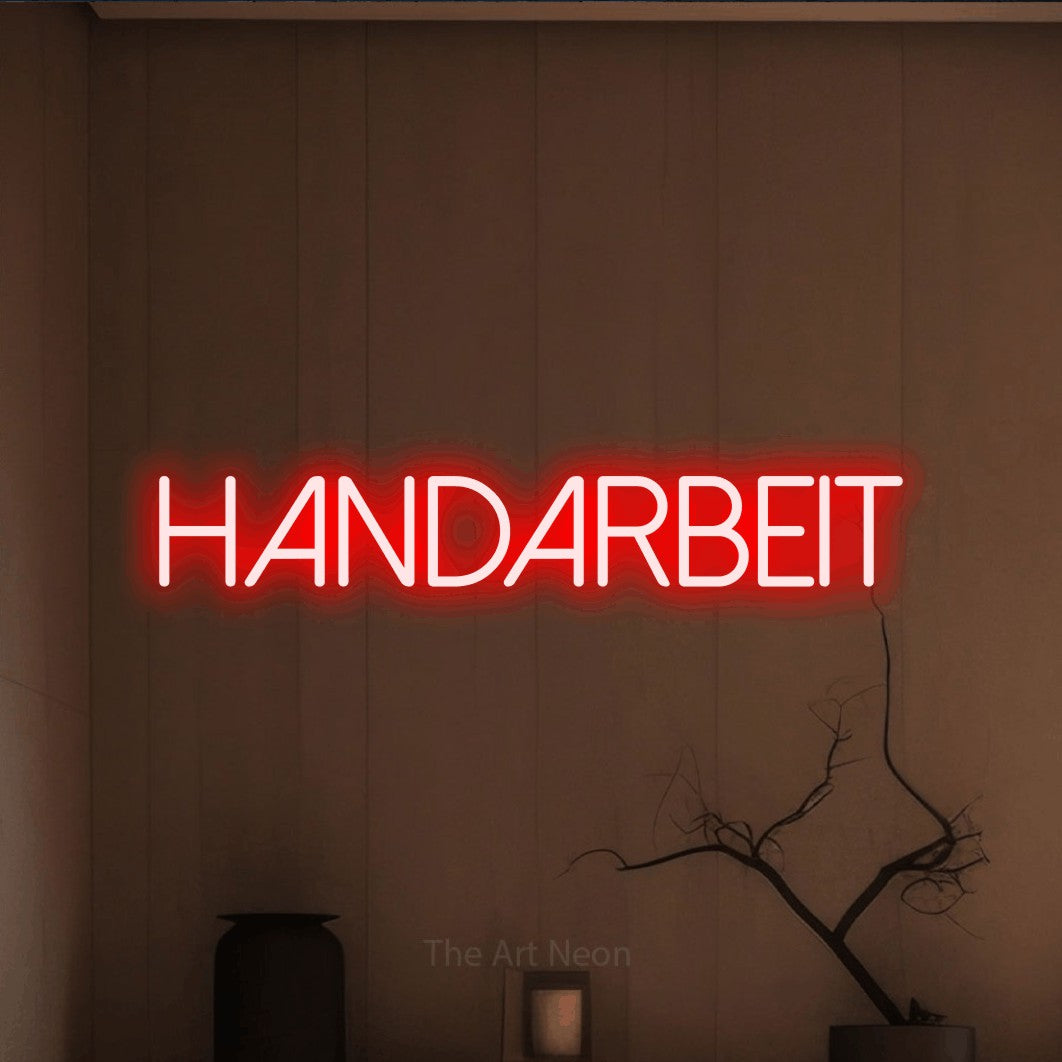 LED neon sign reading “HANDARBEIT”, arranged in a single line.