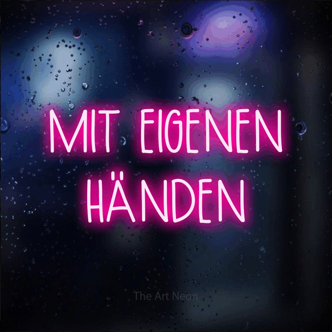 LED neon sign reading “MIT EIGENEN HÄNDEN”, arranged in 2 lines.