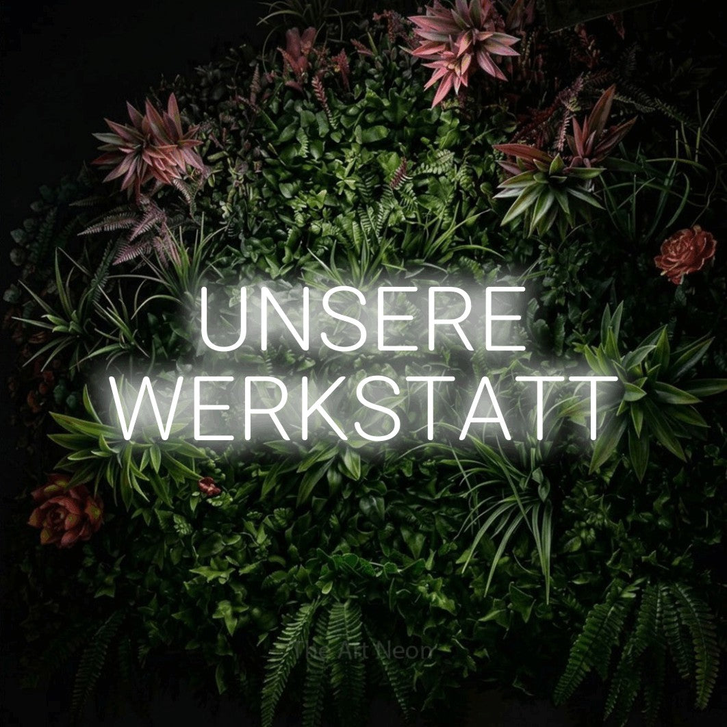 LED neon sign reading “UNSERE WERKSTATT”, arranged in 2 lines.