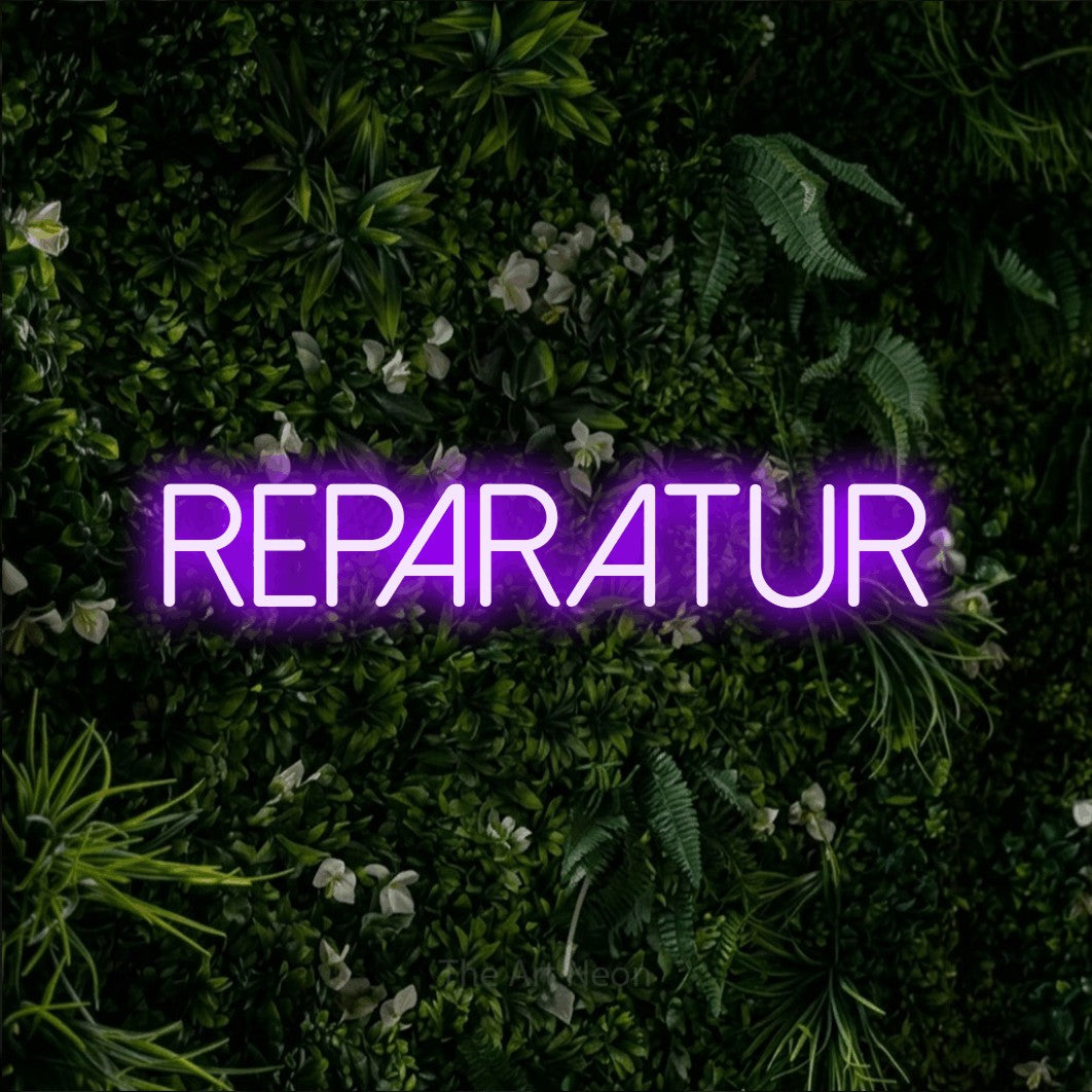 LED neon sign reading “REPARATUR”, arranged in a single line.