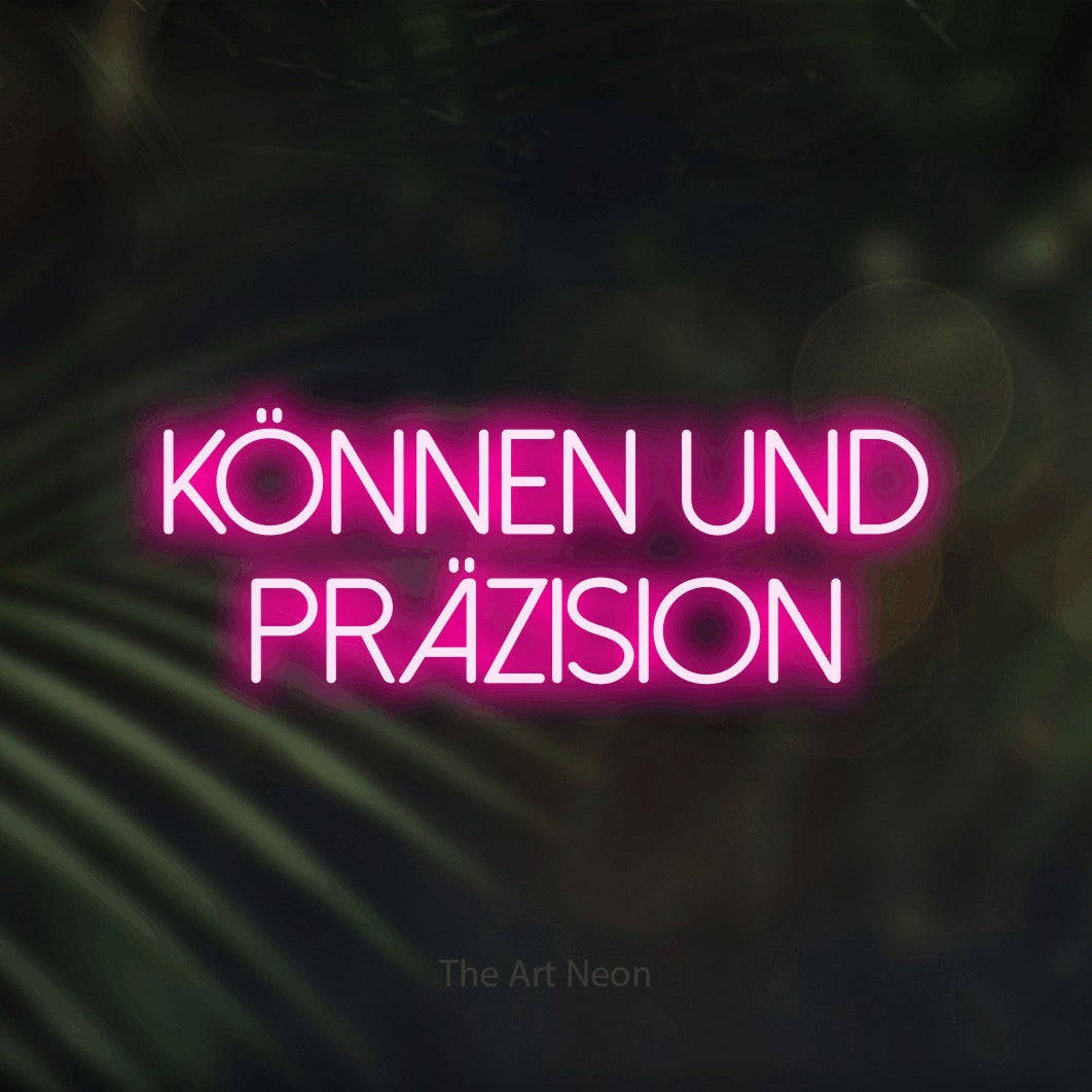 LED neon sign reading “KÖNNEN UND PRÄZISION”, arranged in 2 lines.