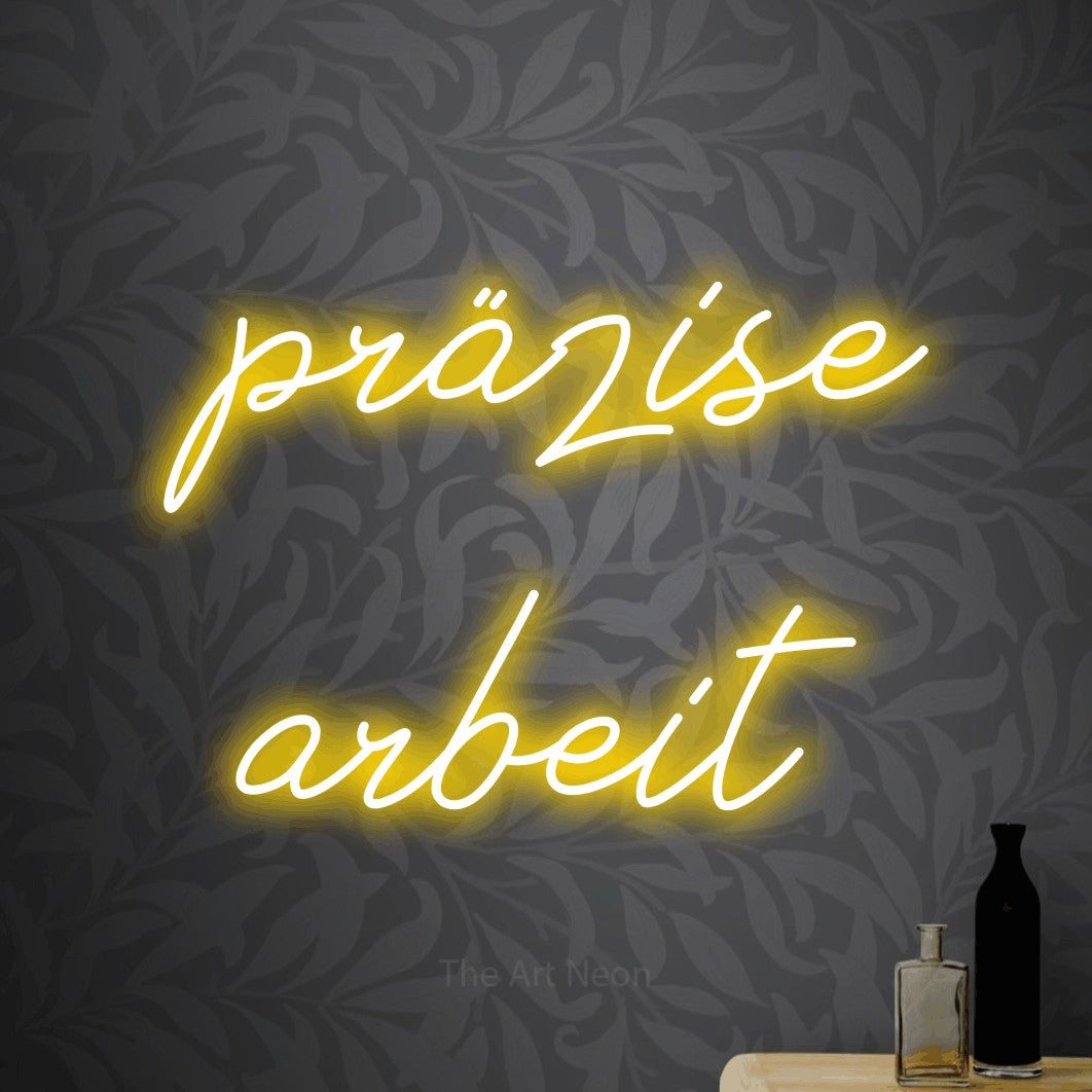 LED neon sign reading “präzise arbeit”, arranged in 2 lines.