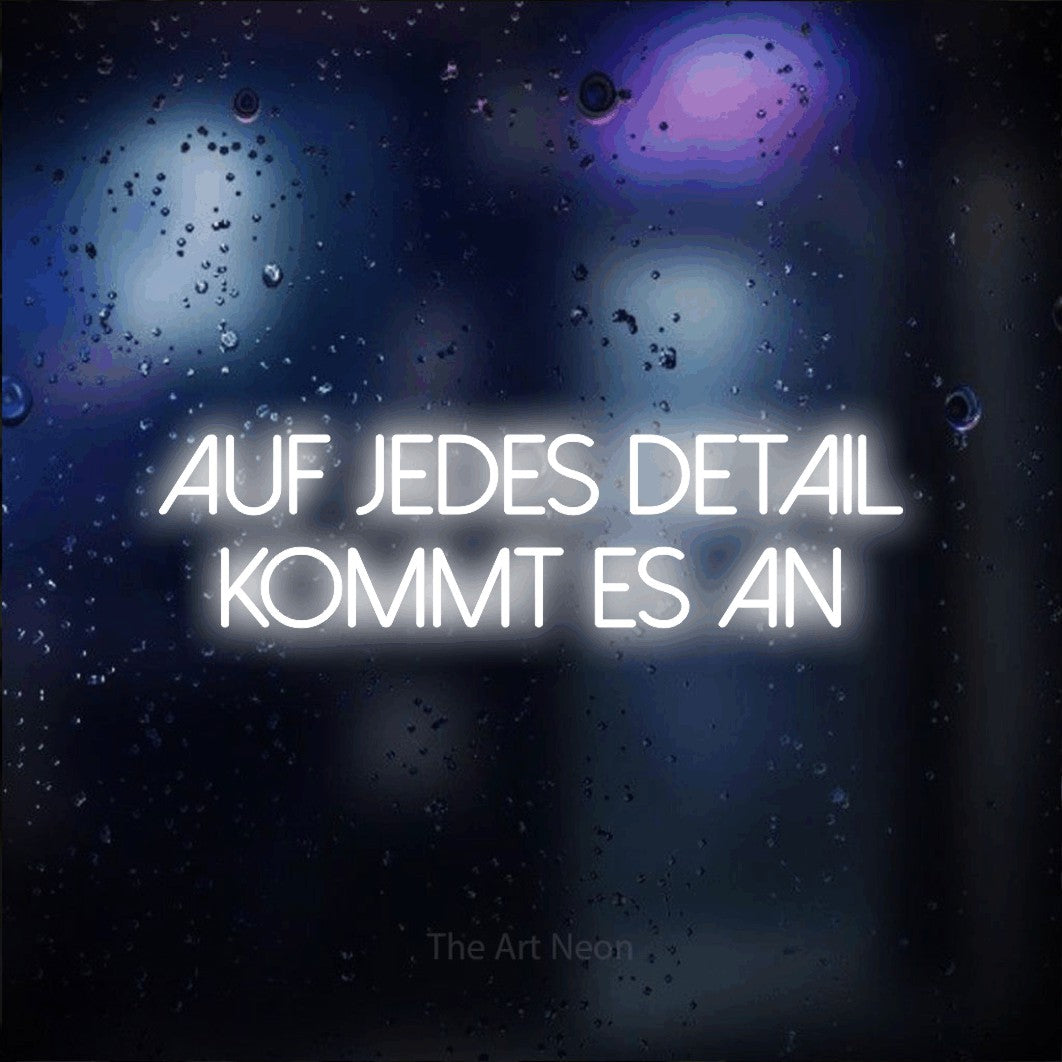 LED neon sign reading “Auf jedes Detail kommt es an”, arranged in 2 lines.