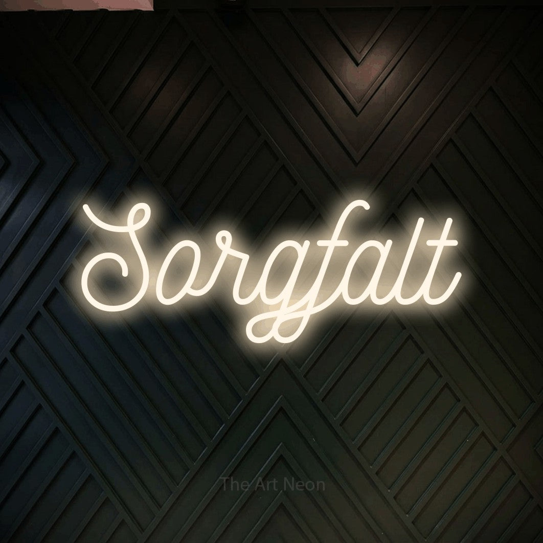 LED neon sign reading “Sorgfalt”, arranged in a single line.