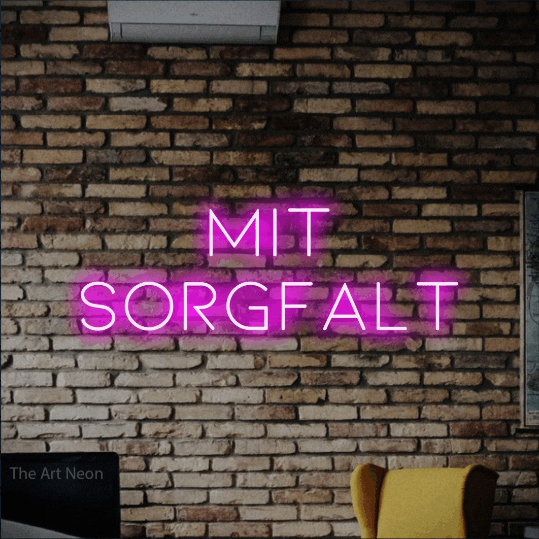 LED neon sign reading “mit SORGFALT”, arranged in 2 lines.