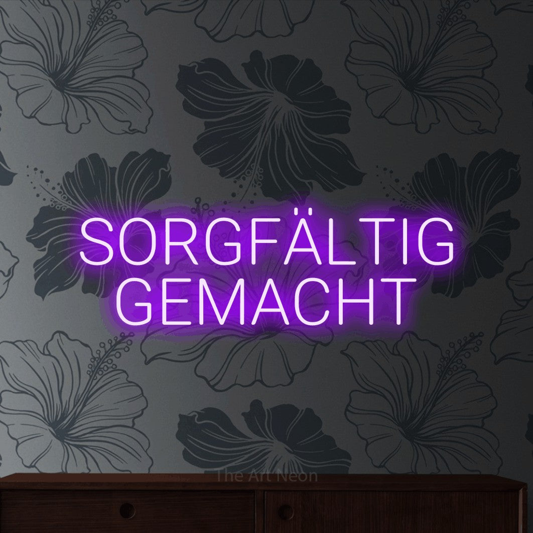 LED neon sign reading “SORGFÄLTIG GEMACHT”, arranged in 2 lines.
