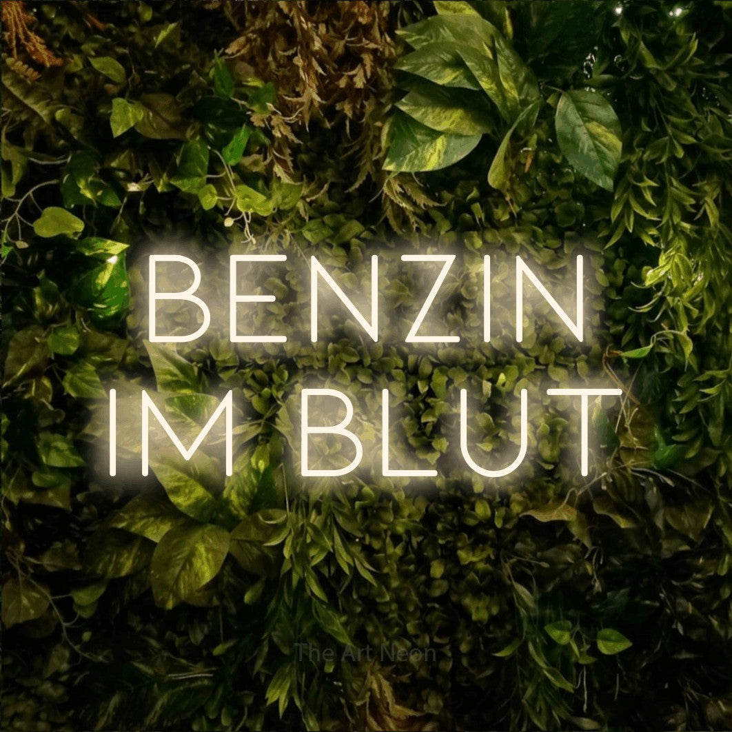 LED neon sign reading “BENZIN IM BLUT”, arranged in 2 lines.