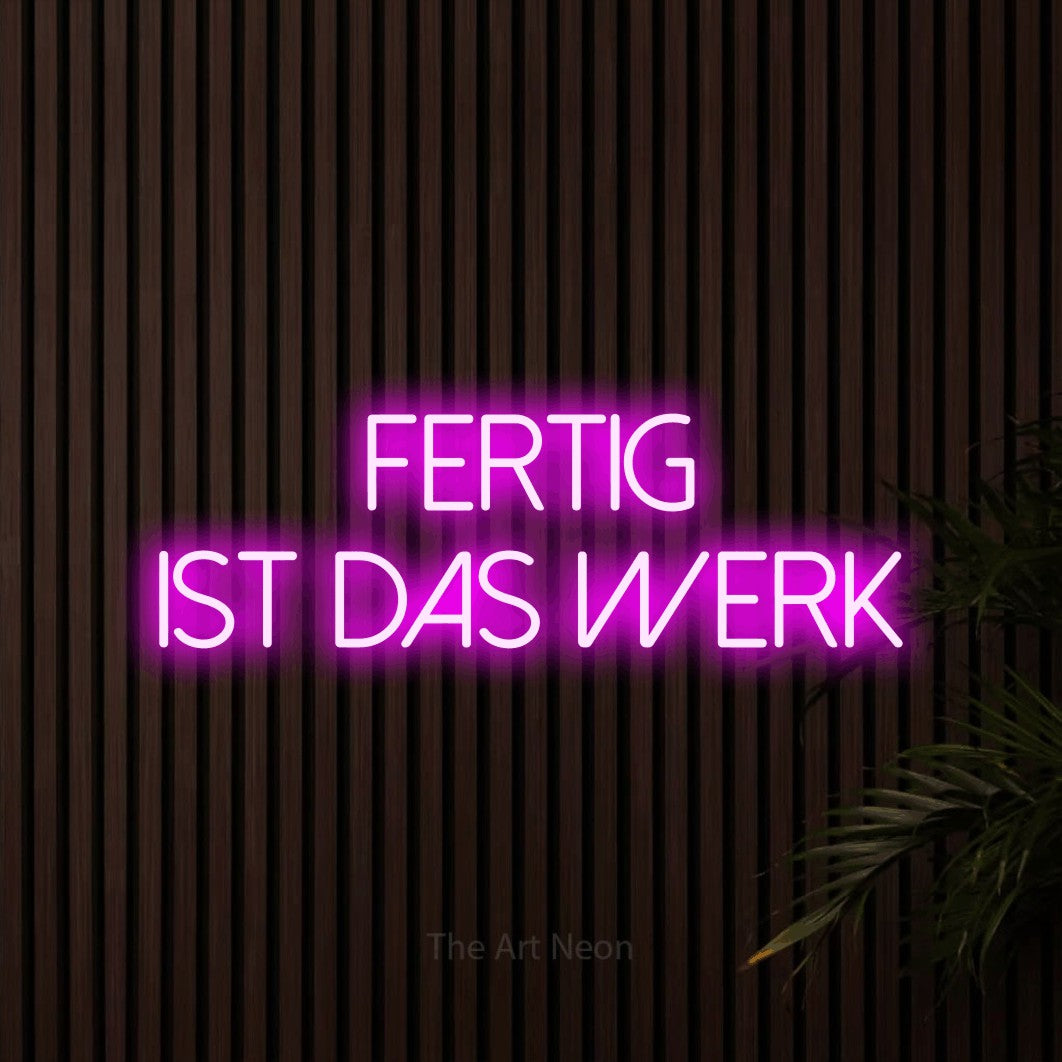 LED neon sign reading “Fertig ist das Werk”, arranged in 2 lines.