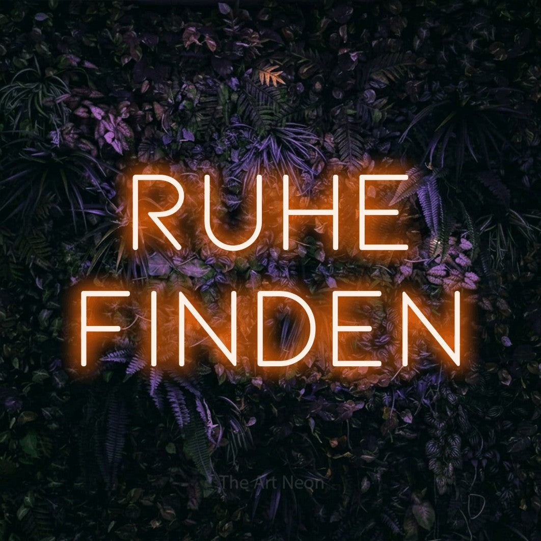 LED neon sign reading “Ruhe finden”, arranged in 2 lines.