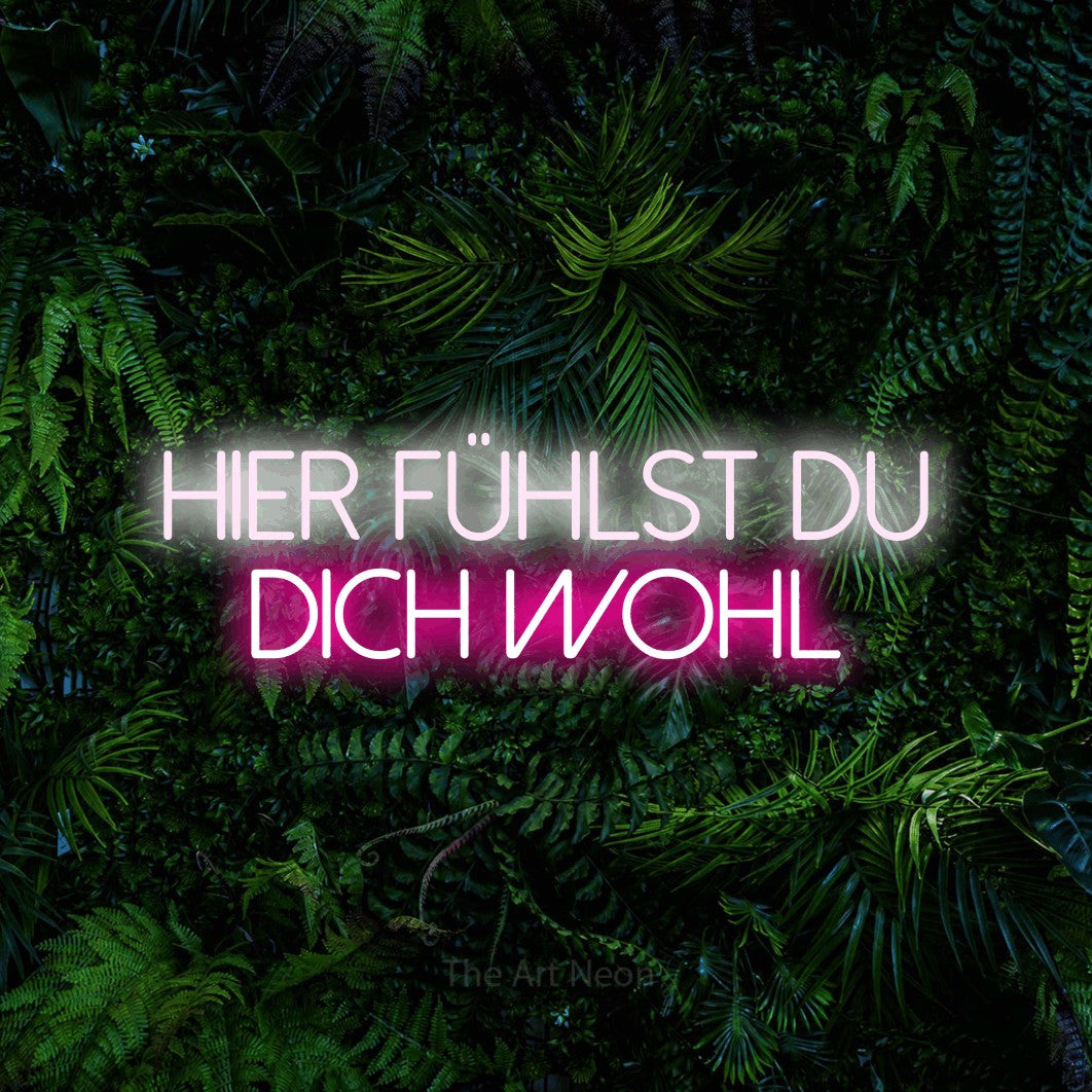 LED neon sign reading “HIER FÜHLST DU DICH WOHL”, arranged in 2 lines.