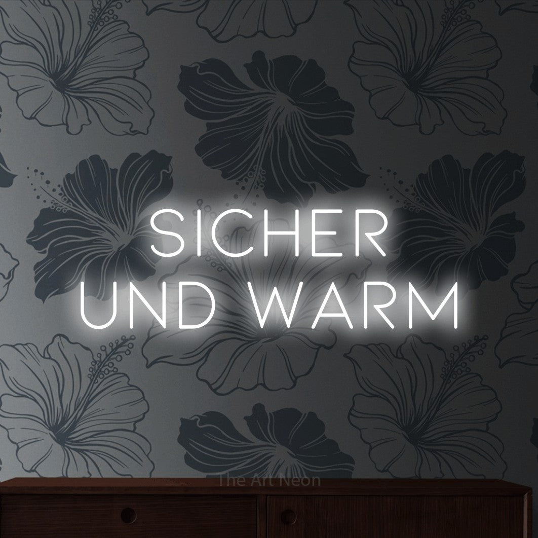 LED neon sign reading “Sicher und warm”, arranged in 2 lines.