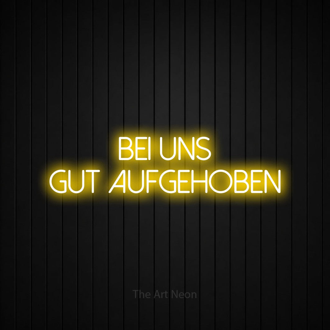 LED neon sign reading “BEI UNS GUT AUFGEHOBEN”, arranged in 2 lines.