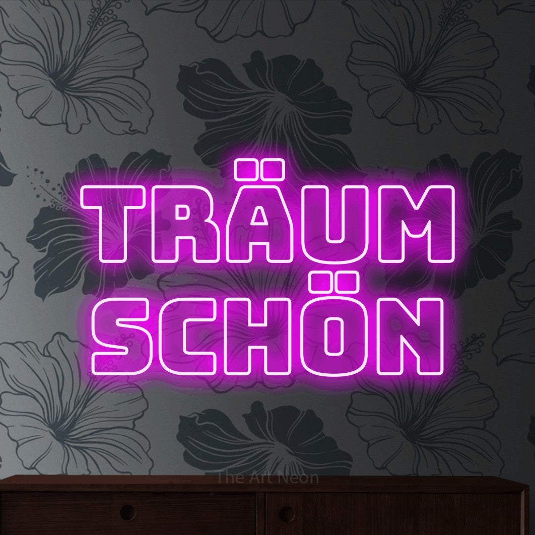 LED neon sign reading “träum schön”, arranged in 2 lines.