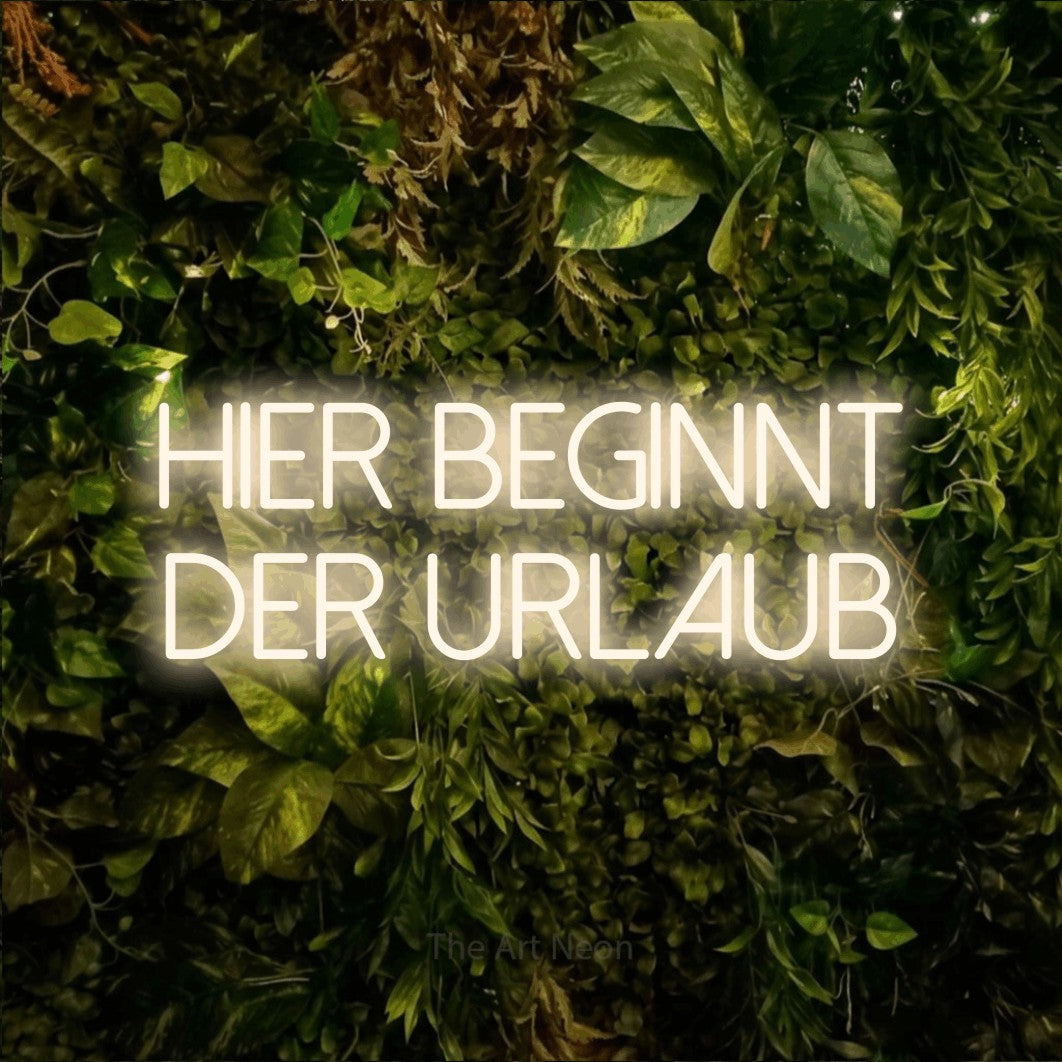 LED neon sign reading “HIER BEGINNT DER URLAUB”, arranged in 2 lines.
