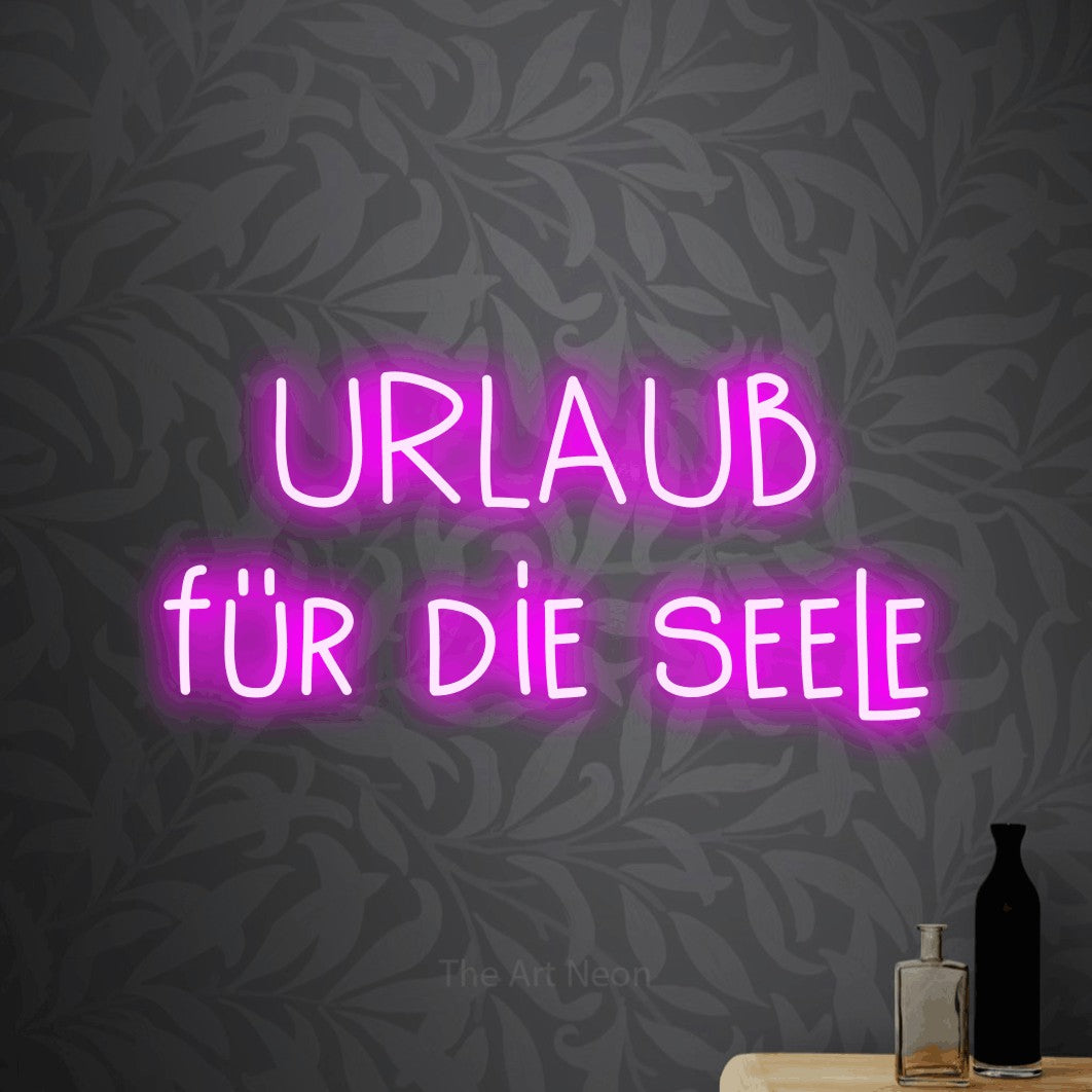 LED neon sign reading “URLAUB für die seele”, arranged in 2 lines.