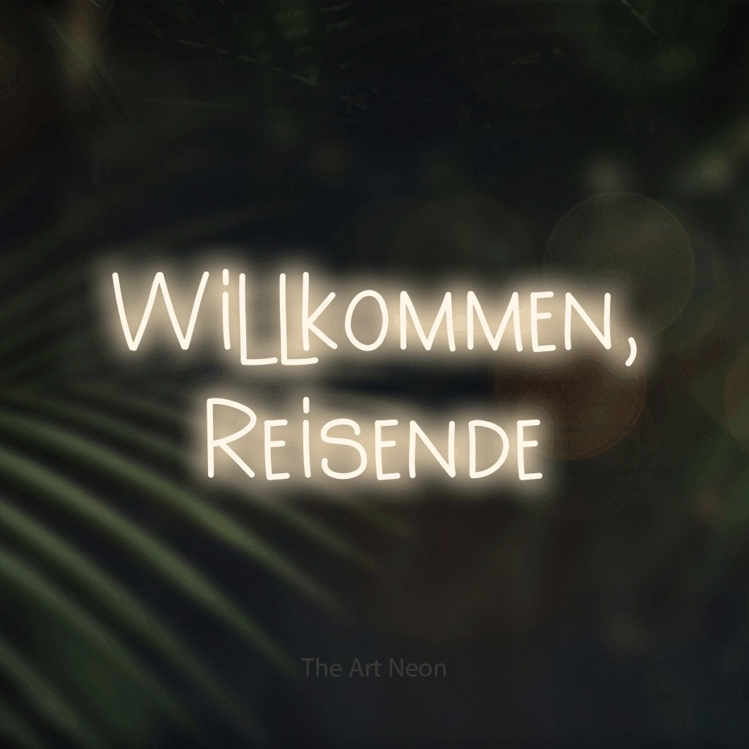 LED neon sign reading “Willkommen, Reisende”, arranged in 2 lines.