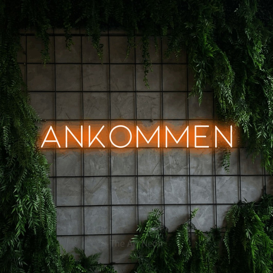 LED neon sign reading “Ankommen”, arranged in a single line.