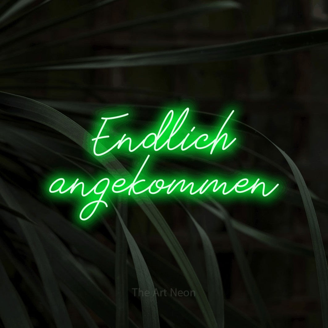 LED neon sign reading “Endlich angekommen”, arranged in 2 lines.