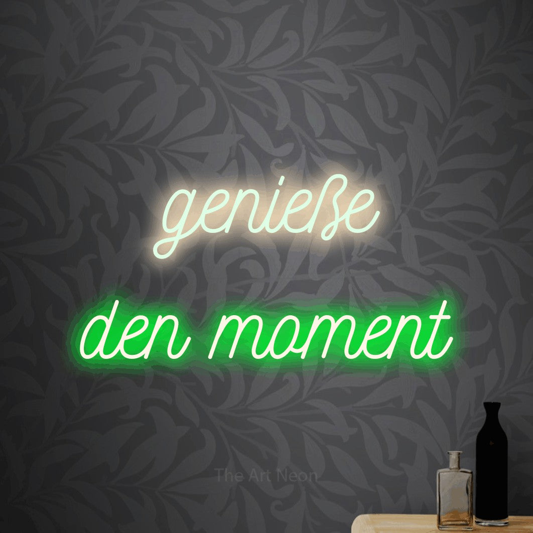 LED neon sign reading “genieße den moment”, arranged in 2 lines.