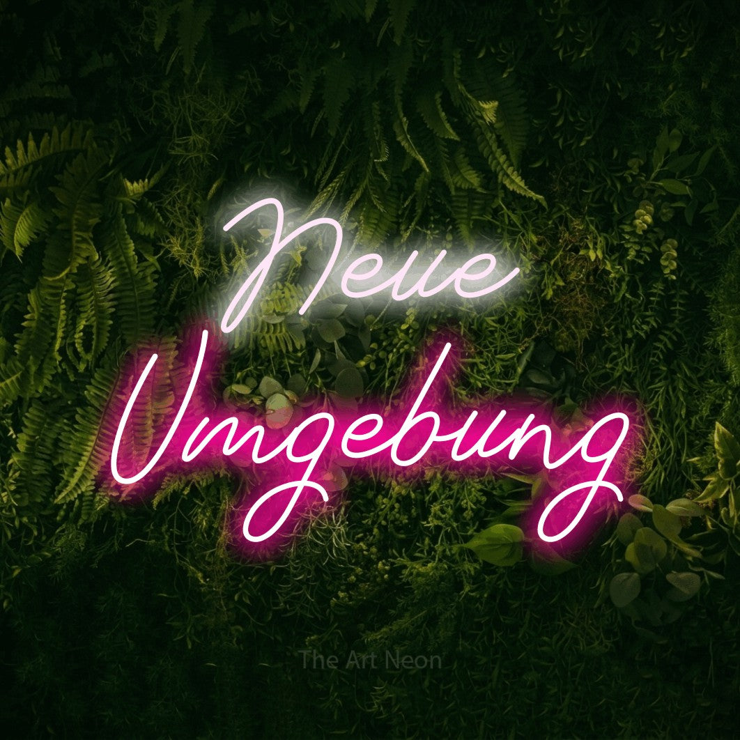 LED neon sign reading “Neue Umgebung”, arranged in 2 lines.